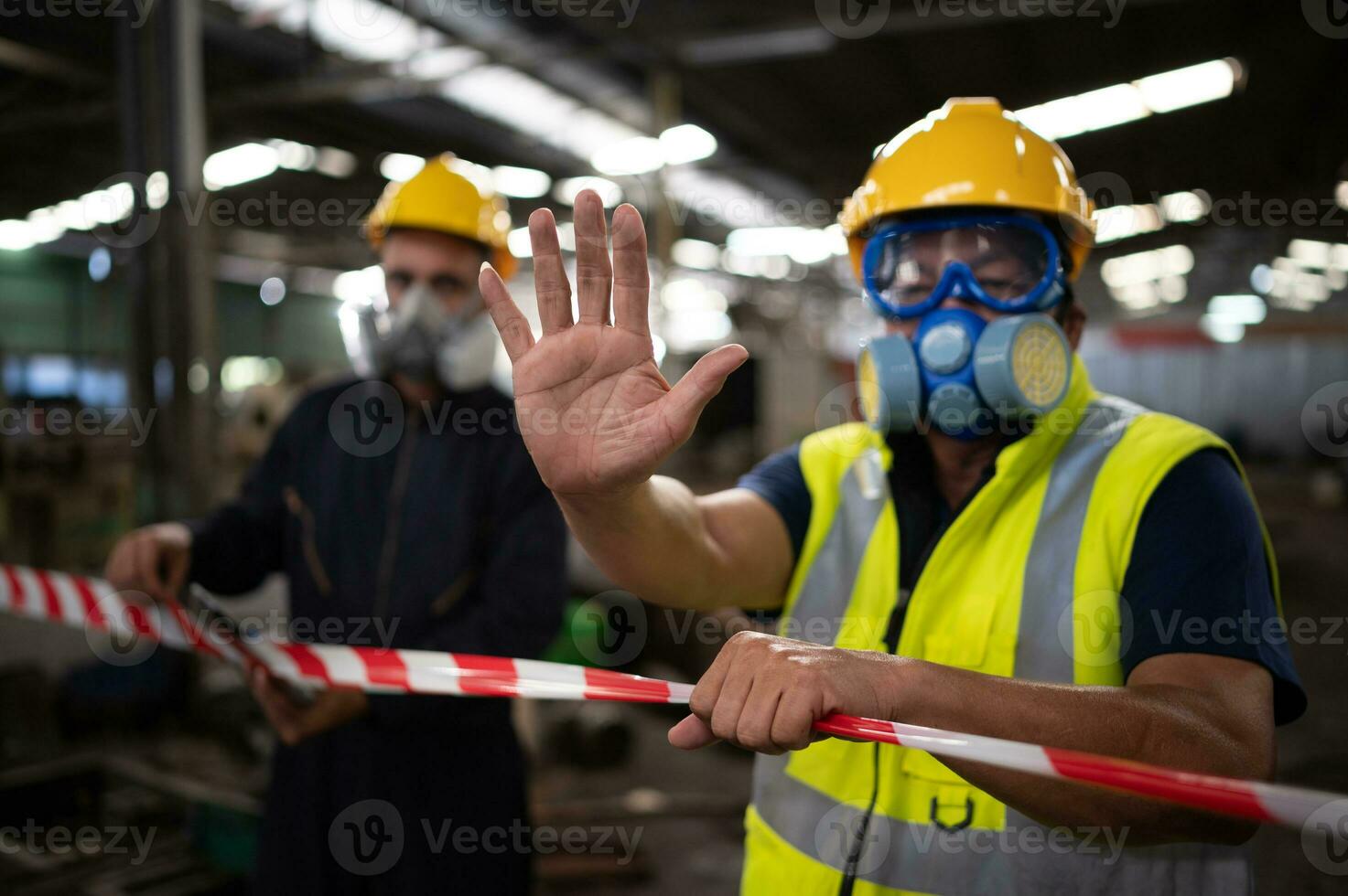 Restricted area, officials employ white and red stripes to block the area where a chemical leak is occurring. To prevent individuals from coming into contact with potentially dangerous chemicals, photo