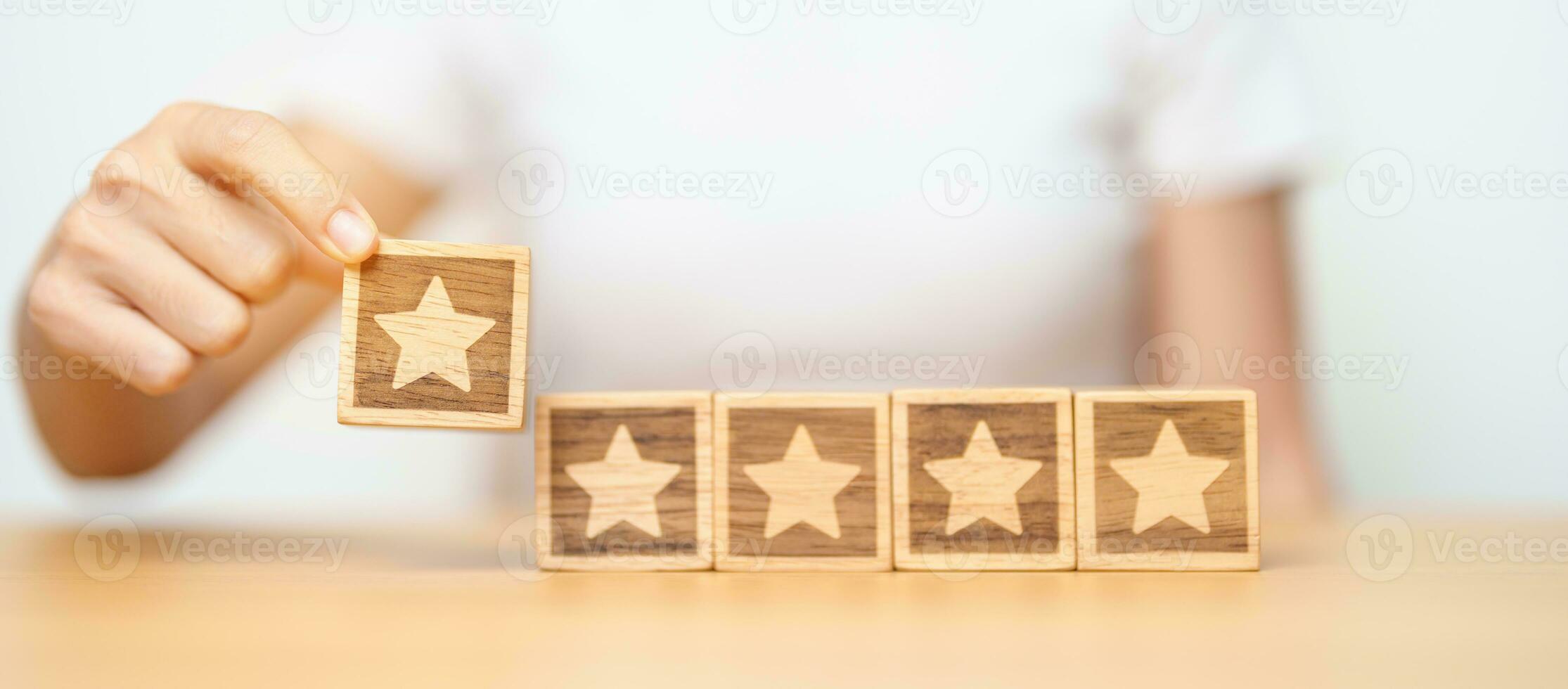 hand holding Star block. Customer choose rating for user reviews. Quality, Service rating, ranking, customer review, satisfaction, evaluation and feedback concept photo