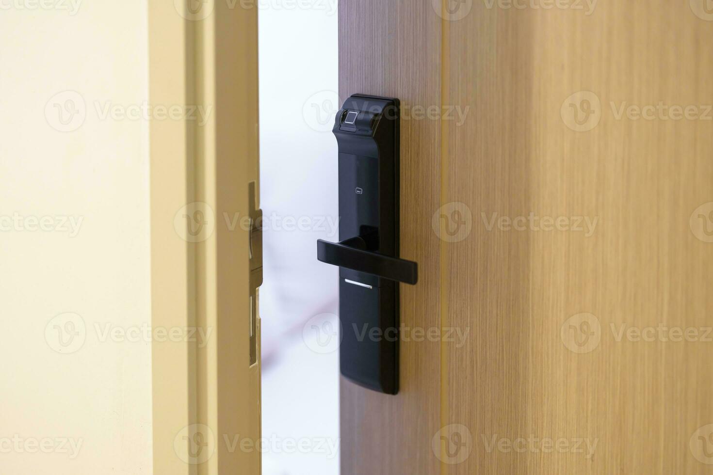 smart digital door lock while open or close the door at home or apartment. NFC Technology, Fingerprint scan, keycard, PIN number, smartphone, electrical and contactless lifestyle concepts photo