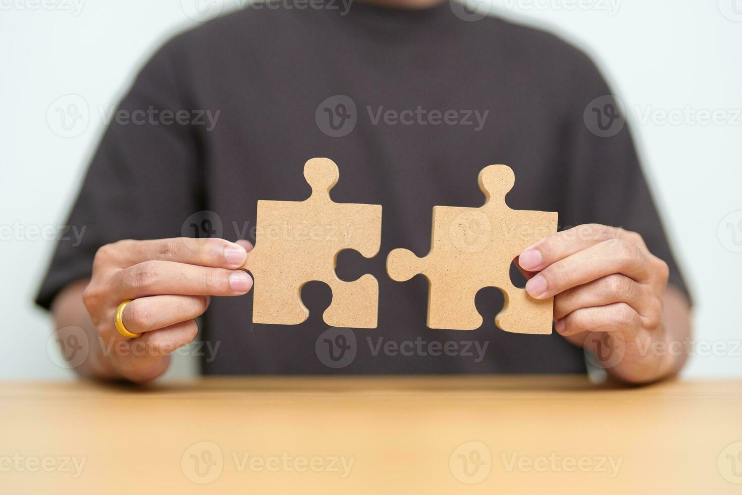 Hand connecting couple puzzle piece. Business Solving, mission, challenge, success, goals, target and strategy concepts photo