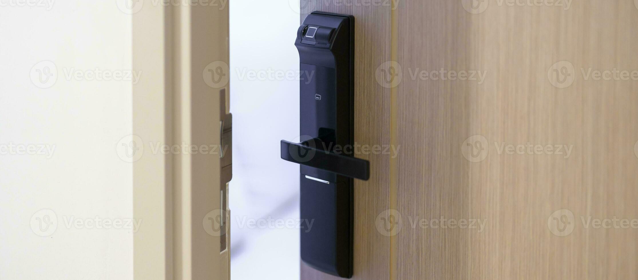 smart digital door lock while open or close the door at home or apartment. NFC Technology, Fingerprint scan, keycard, PIN number, smartphone, electrical and contactless lifestyle concepts photo