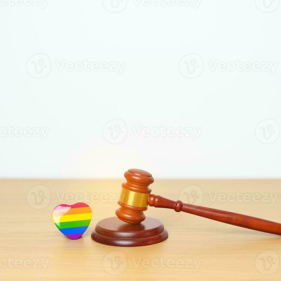 LGBT Law and Pride month concepts. gavel justice hammer with rainbow colorful heart shape for Lesbian, Gay, Bisexual, Transgender, Queer, Intersex, Asexual, Agender, Non Binary, Two Spirit, Pansexual photo