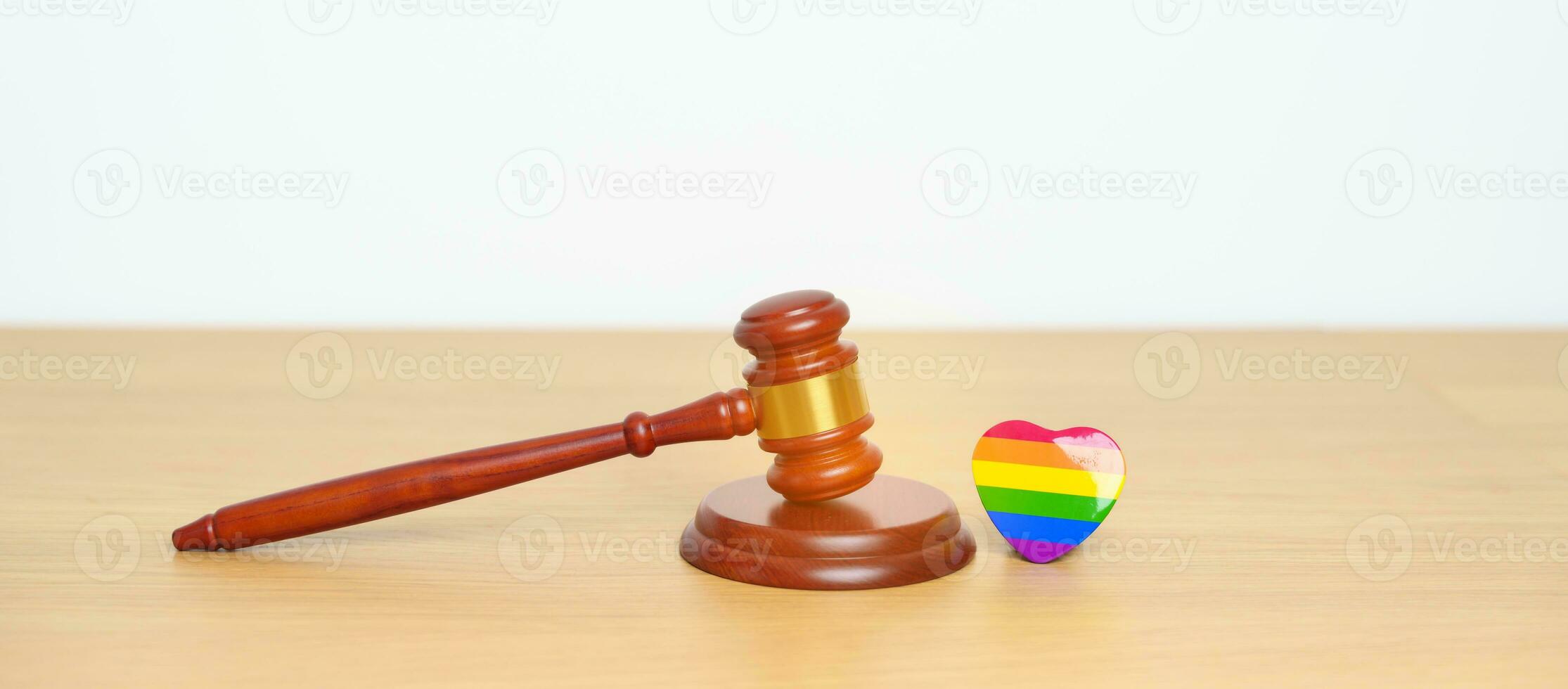 LGBT Law and Pride month concepts. gavel justice hammer with rainbow colorful heart shape for Lesbian, Gay, Bisexual, Transgender, Queer, Intersex, Asexual, Agender, Non Binary, Two Spirit, Pansexual photo