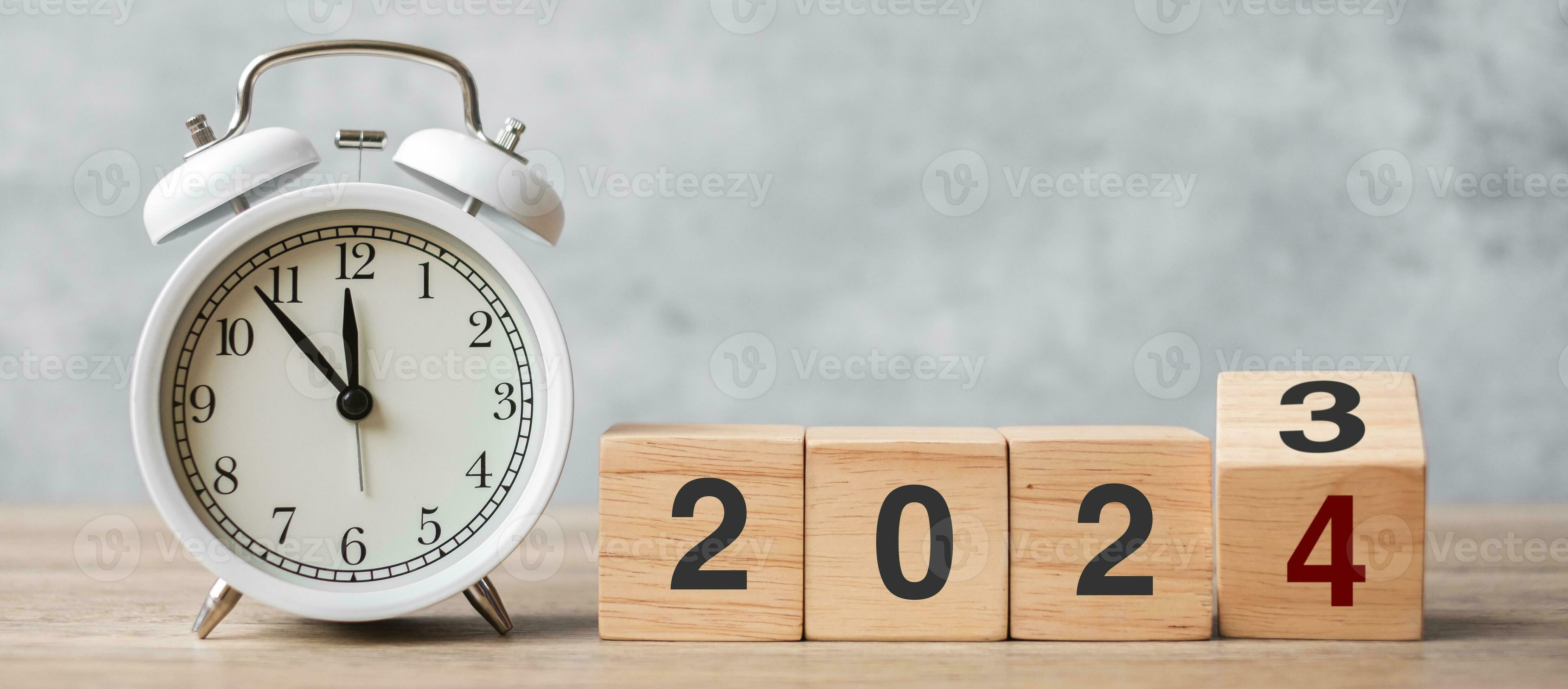 Happy New Year with vintage alarm clock and flipping 2023 change to