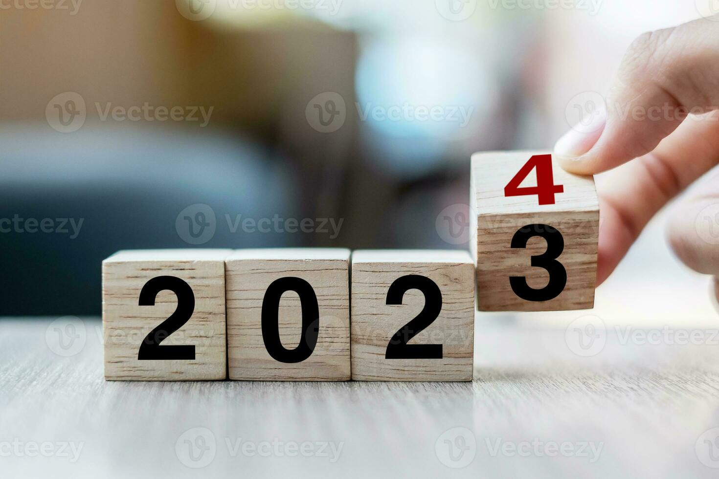 hand flipping block 2023 to 2024 text on table. Resolution, strategy, plan, goal, motivation, reboot, business and New Year holiday concepts photo