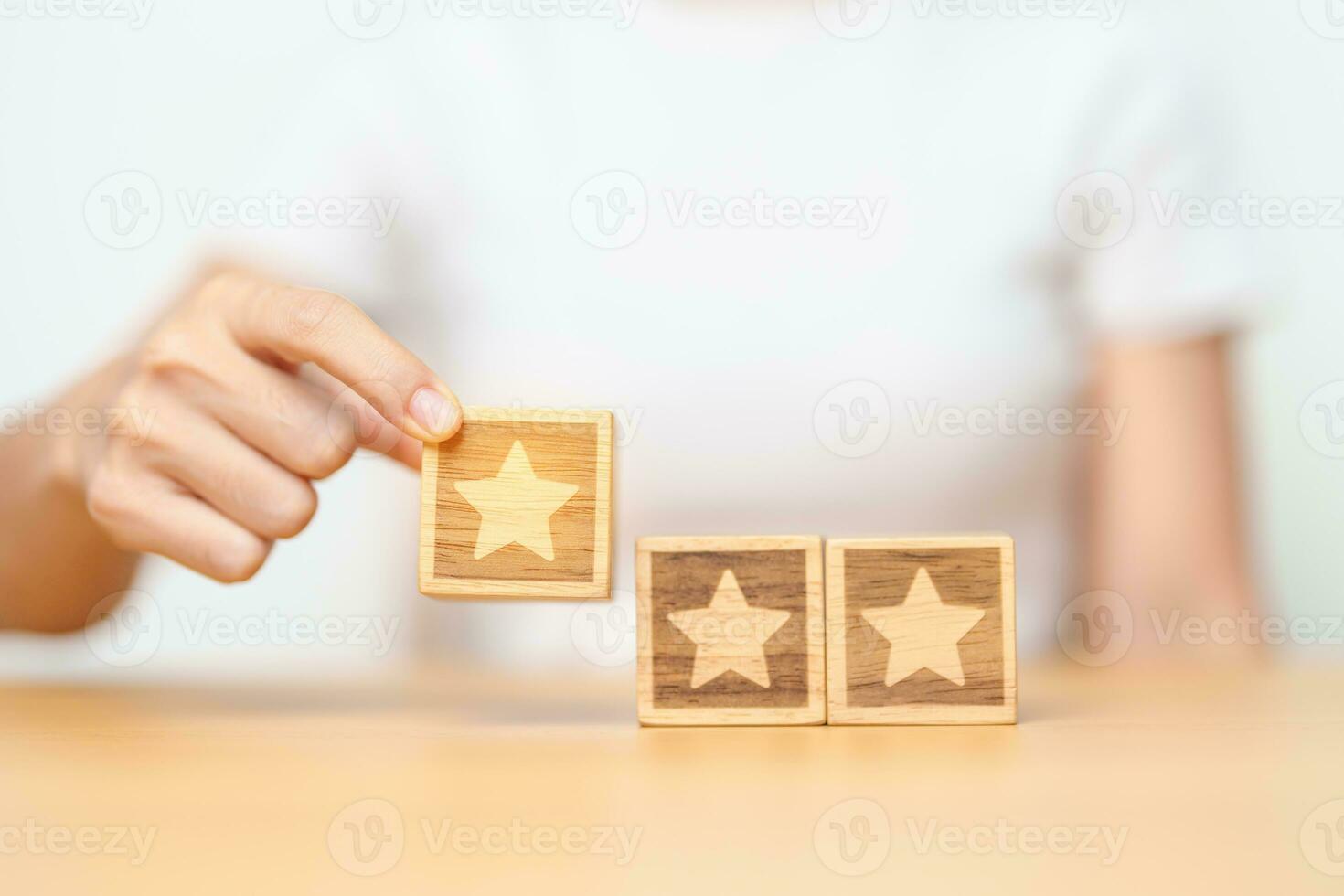 hand holding Star block. Customer choose rating for user reviews. Quality, Service rating, ranking, customer review, satisfaction, evaluation and feedback concept photo