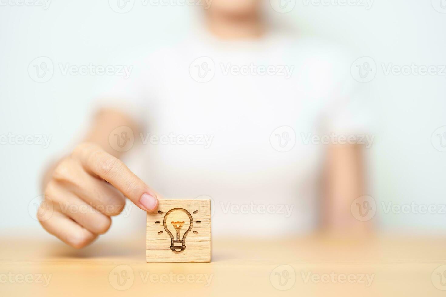 hand hold lightbulb  block with business Idea, strategy, innovation , creativity, learning, brainstorming  and success concept photo