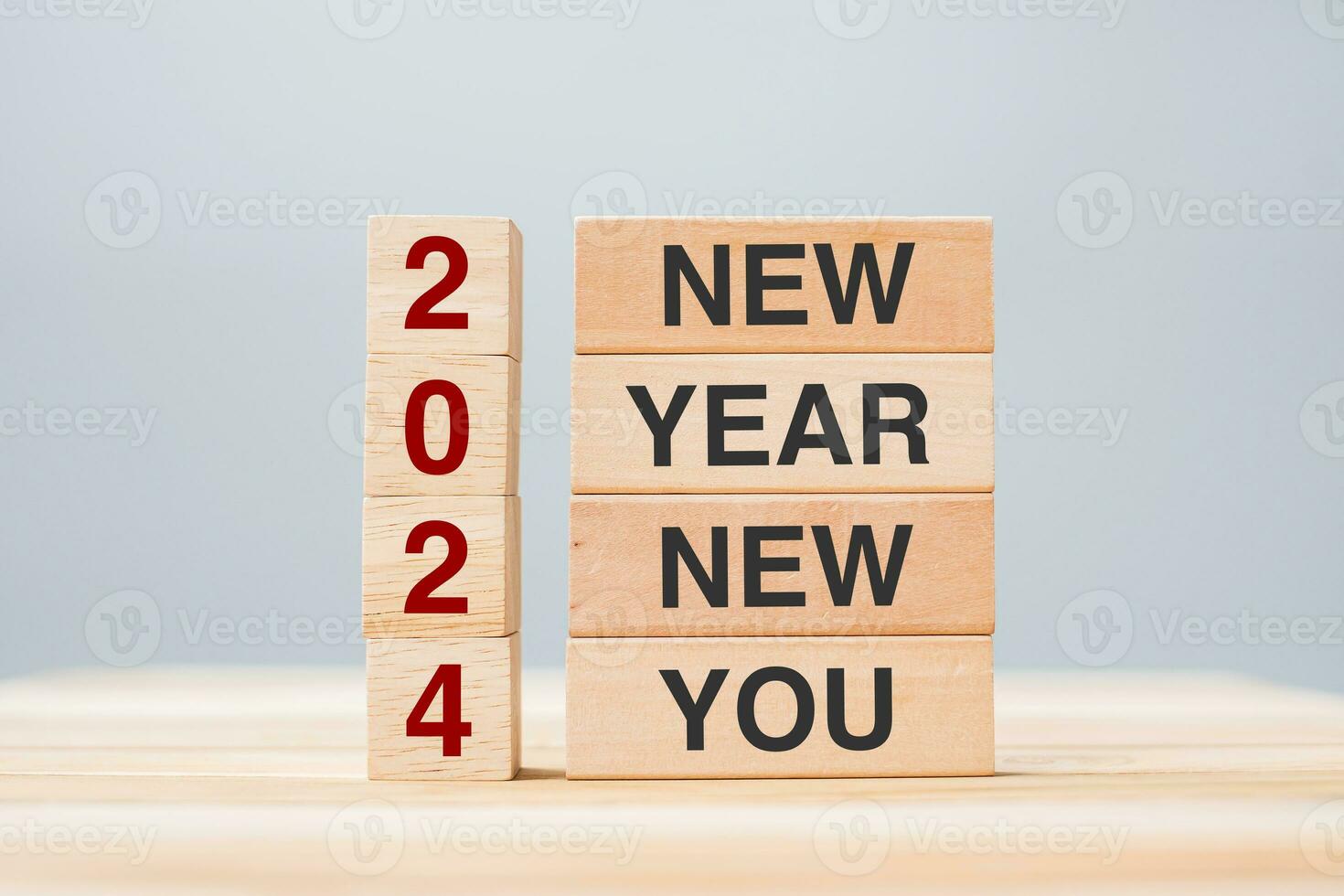hand holding wooden block with text 2024 NEW YEAR NEW YOU on table background. Resolution, strategy, goal, business and holiday concepts photo