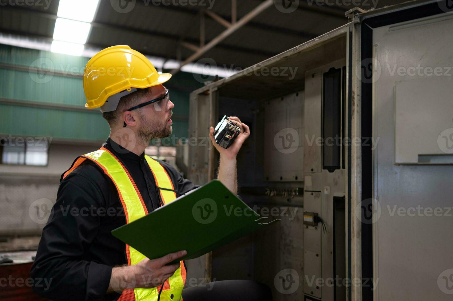 The engineer inspects the electrical system and repairs the mechanical system in the machine control cabinet. in order for the machine to return to normal operation photo