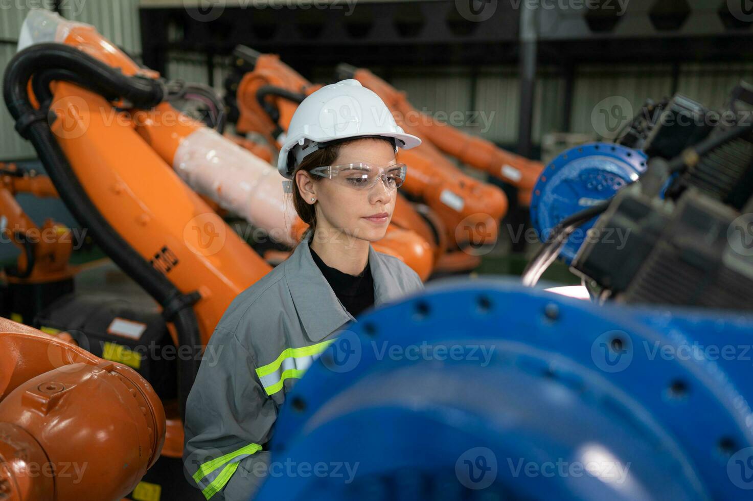 A female auditor Inspected to account for the company's robot assets that were brought to the warehouse before delivering to customers. photo
