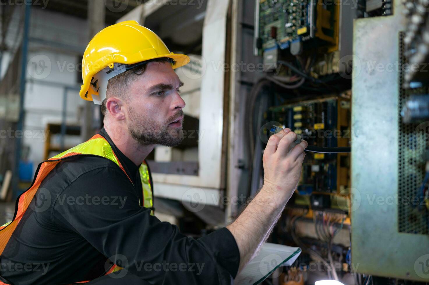 The engineer inspects the electrical system and repairs the mechanical system in the machine control cabinet. in order for the machine to return to normal operation photo