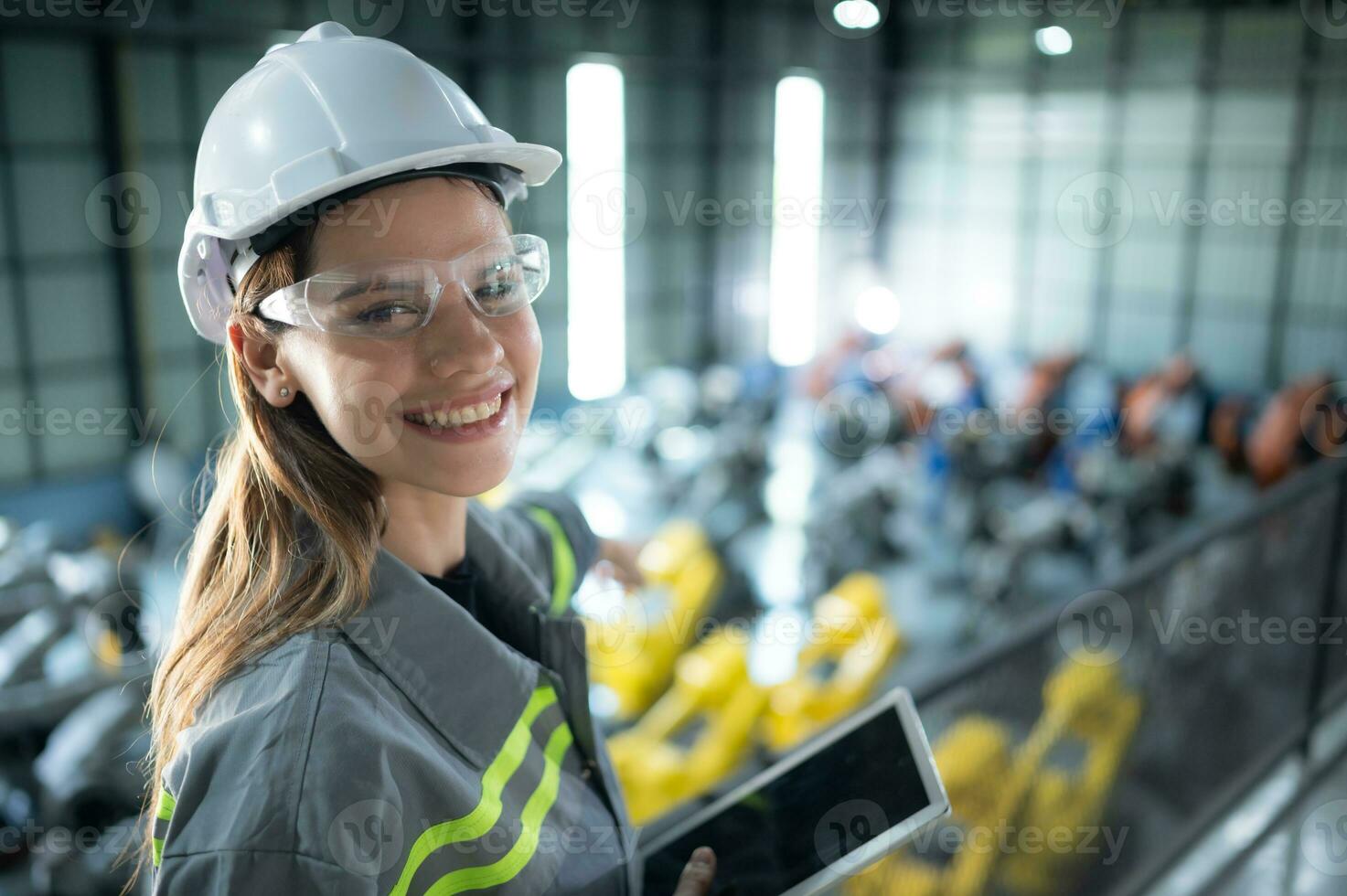 A female auditor Inspected to account for the company's robot assets that were brought to the warehouse before delivering to customers. photo
