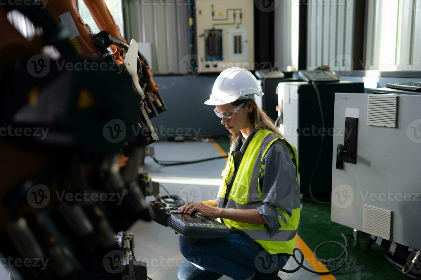 The electronic circuit board used to control the operation of the robotics arm. It is a artificial intelligence that engineers have to check and update software all the time. photo
