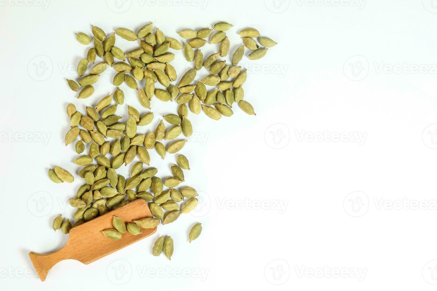 Cardamom spice wooden spoon photo