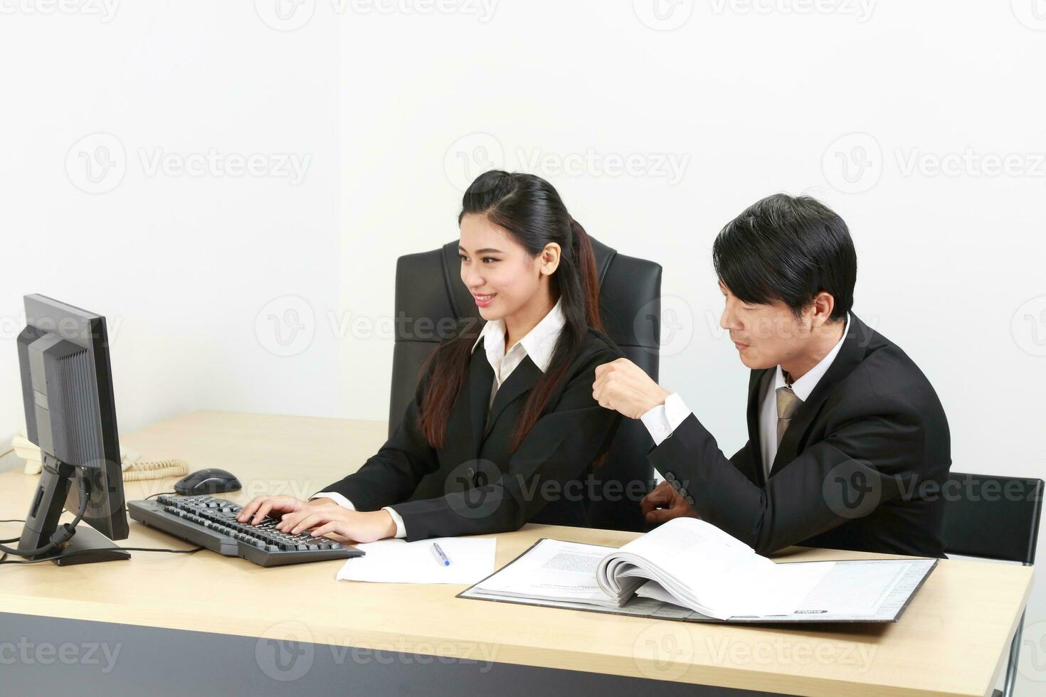 Young Asian man woman wearing business office suit chair table computer white background photo
