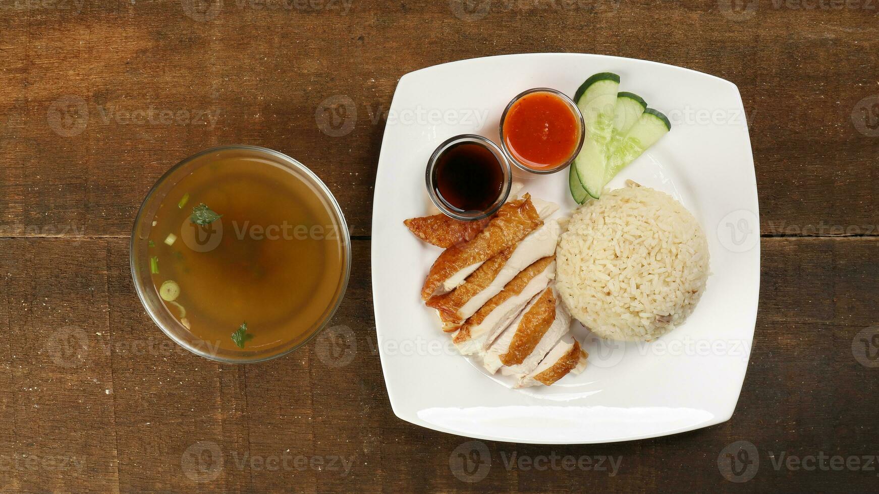 South east asian style chicken rice set steamed roasted sliced chicken with soup dark chilli sauce malaysia china photo