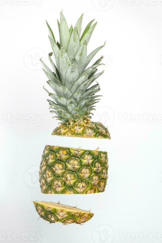 Pineapple whole rough skin slice chopped flying elevated photo