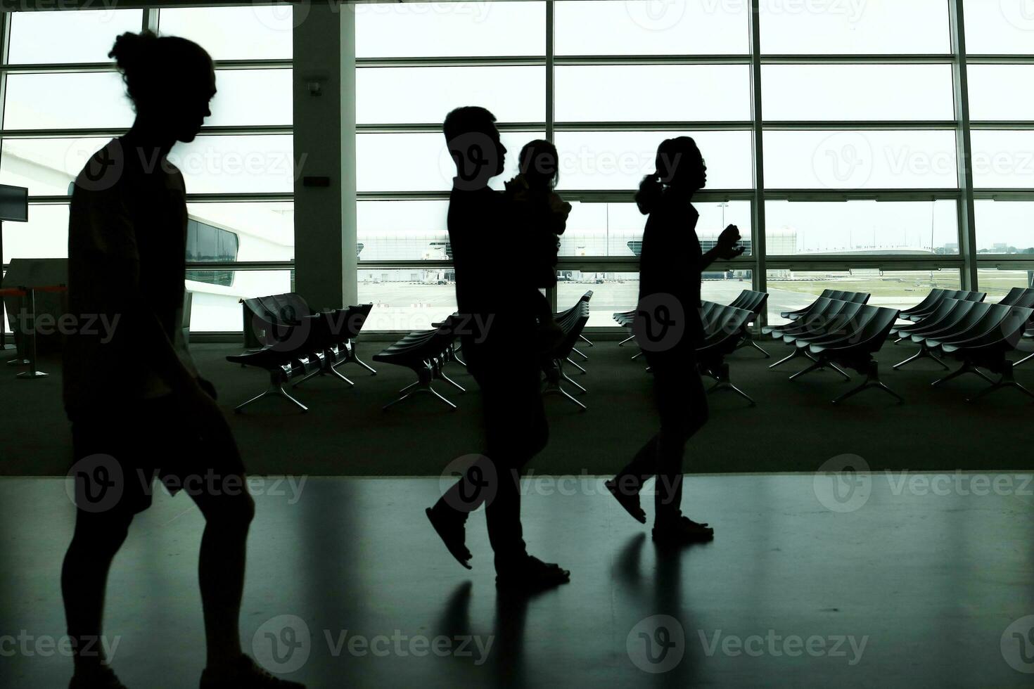 silhouette shadow in airport man woman walking shadow photo