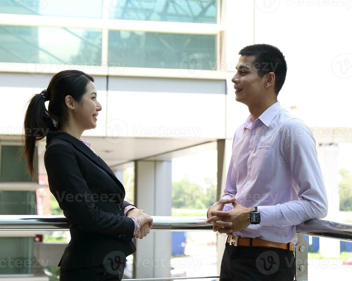 Young south east Asian middle eastern man woman business colleague outdoor stand pose photo