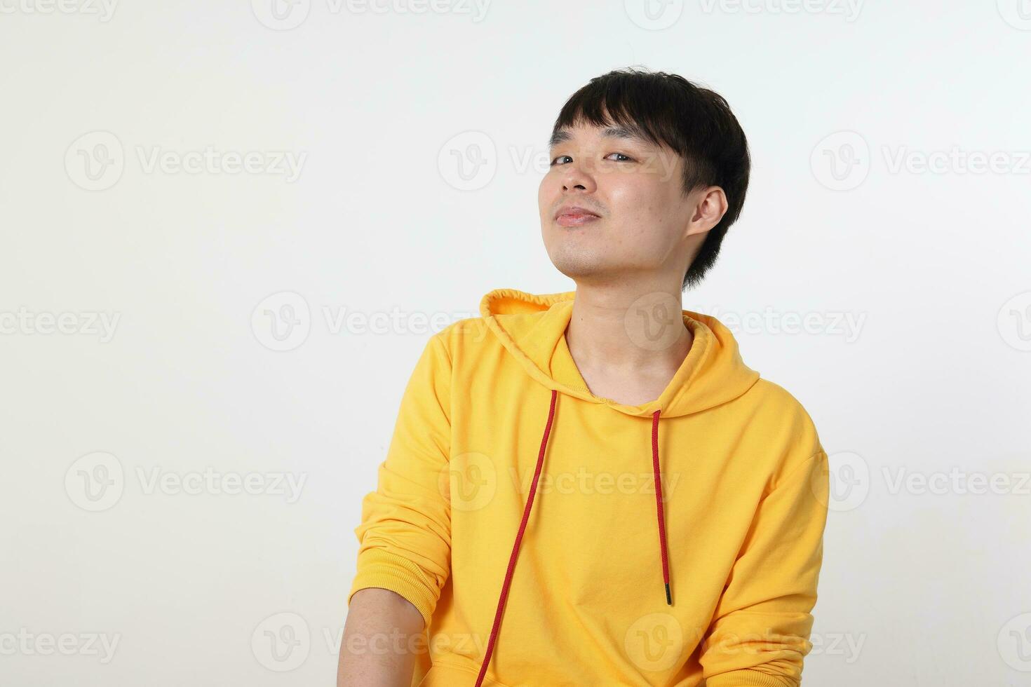 Young good looking Asian chinese malay man pose face body expression mode emotion on white background witty funny smile ah ha moment photo