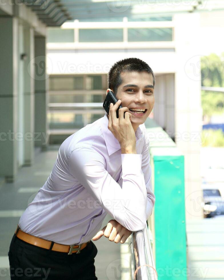 Young south east Asian middle eastern man woman business colleague outdoor stand pose photo
