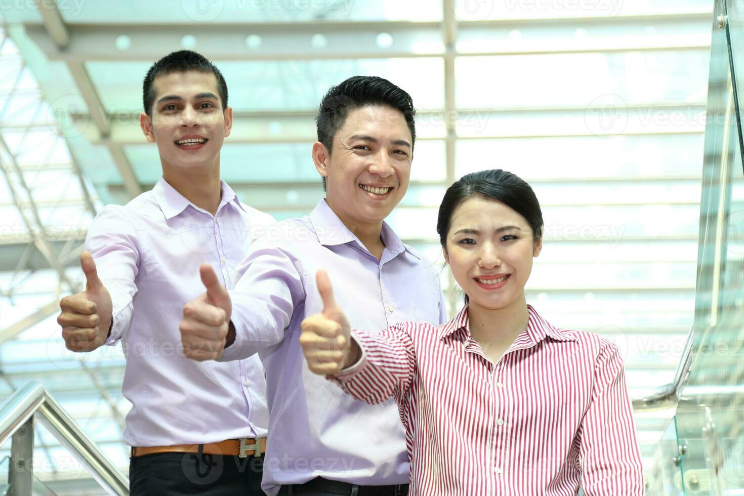 Young south east Asian middle eastern man woman business colleague outdoor stand pose photo