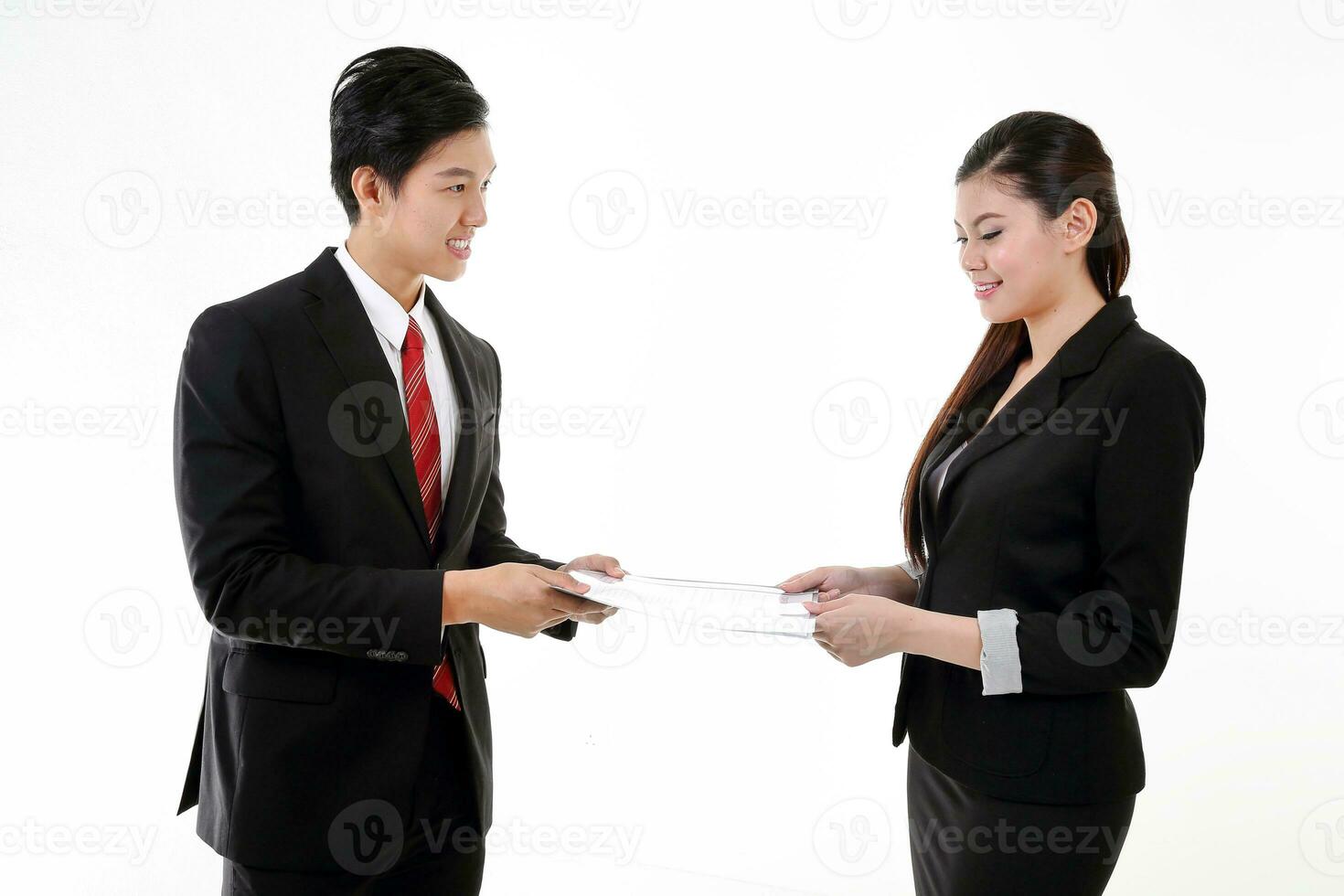 South East Asian young Chinese man woman wearing formal business office ware on white background point white blank writing board paper copy text space photo
