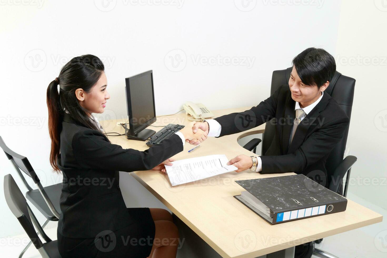 Young Asian man woman wearing business office suit chair table computer white background photo