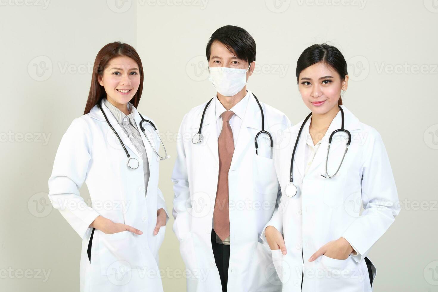 Young Asian male female doctor wearing apron uniform tunic apron hold photo