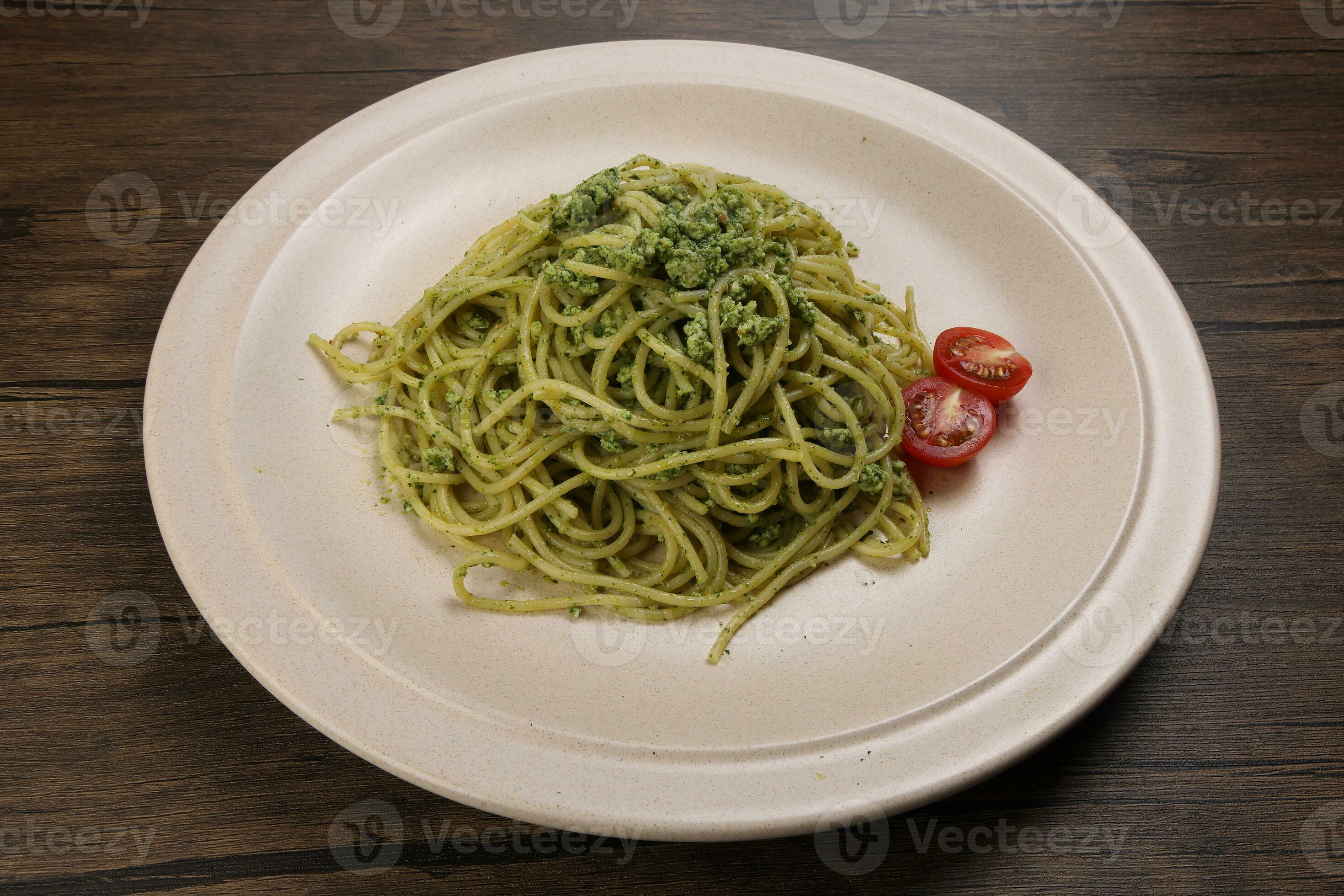 Asian style spaghetti with minced chicken spinach thai basil tomato