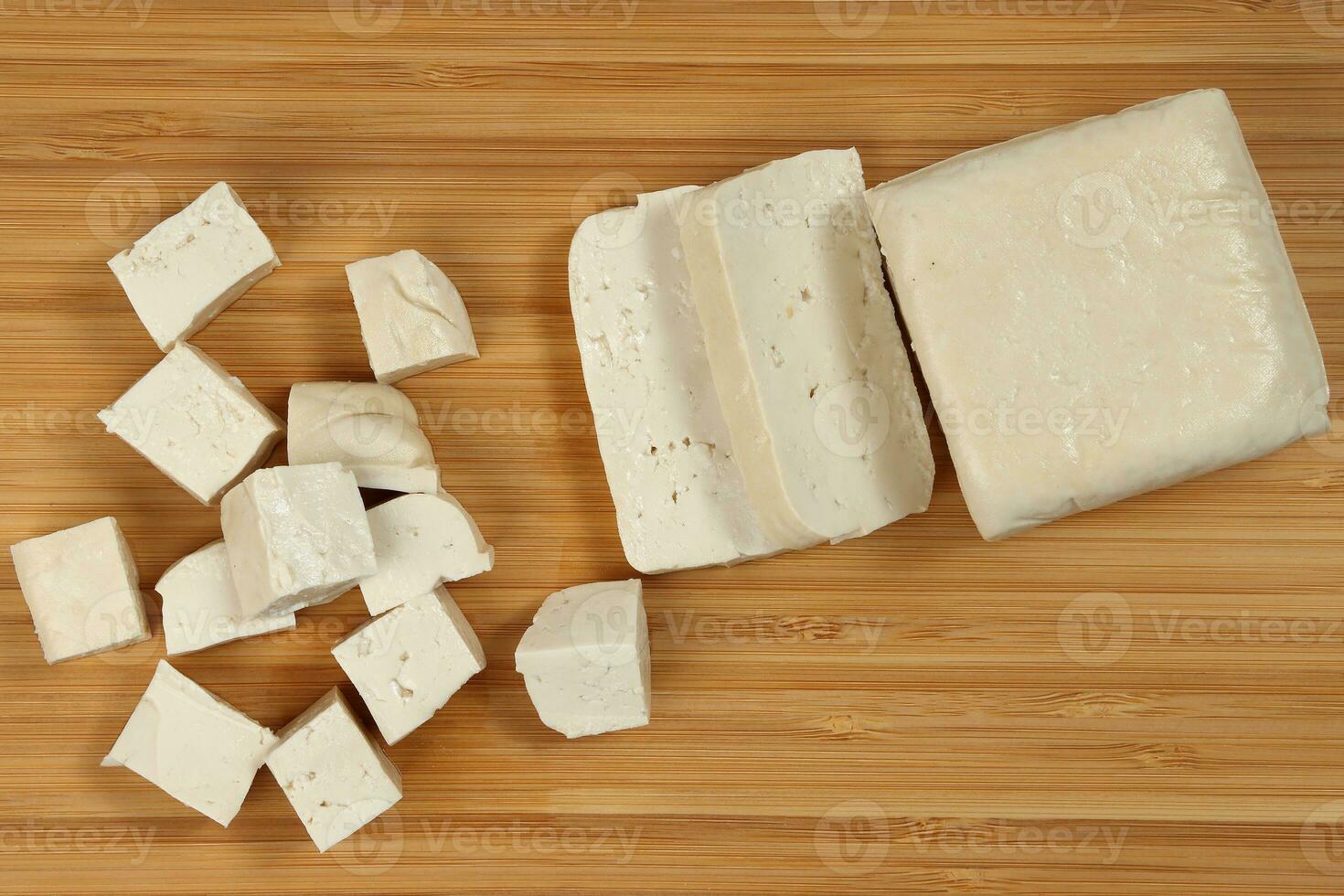 Soyabeans soya bean curd tofu wooden board block slice dice chopped photo