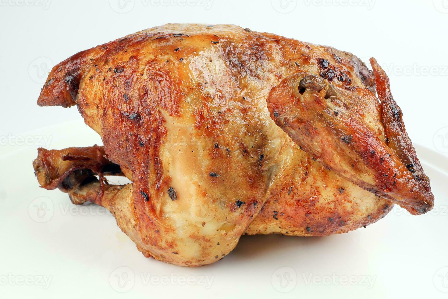 Whole roasted grilled chicken poultry bird on white background photo