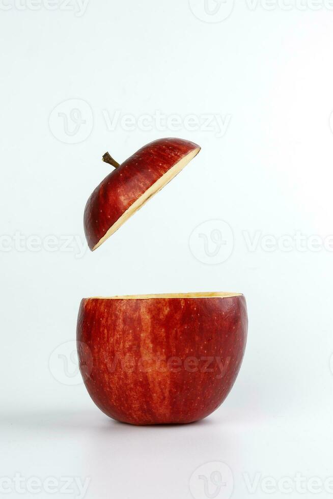 Health Red Cut Apple floating top slice juice drink idea concept on white background photo
