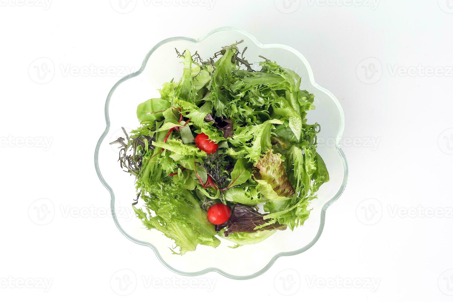 Mix leafy vegetable salad green purple lettuce glass bowl photo
