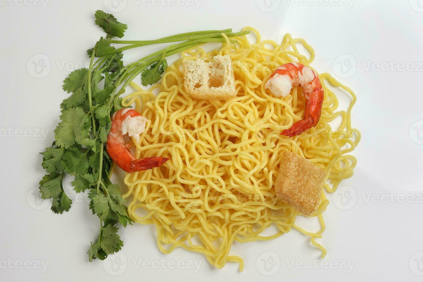 Fresh yellow egg noodle prawn tofu coriander leaf on whit background photo