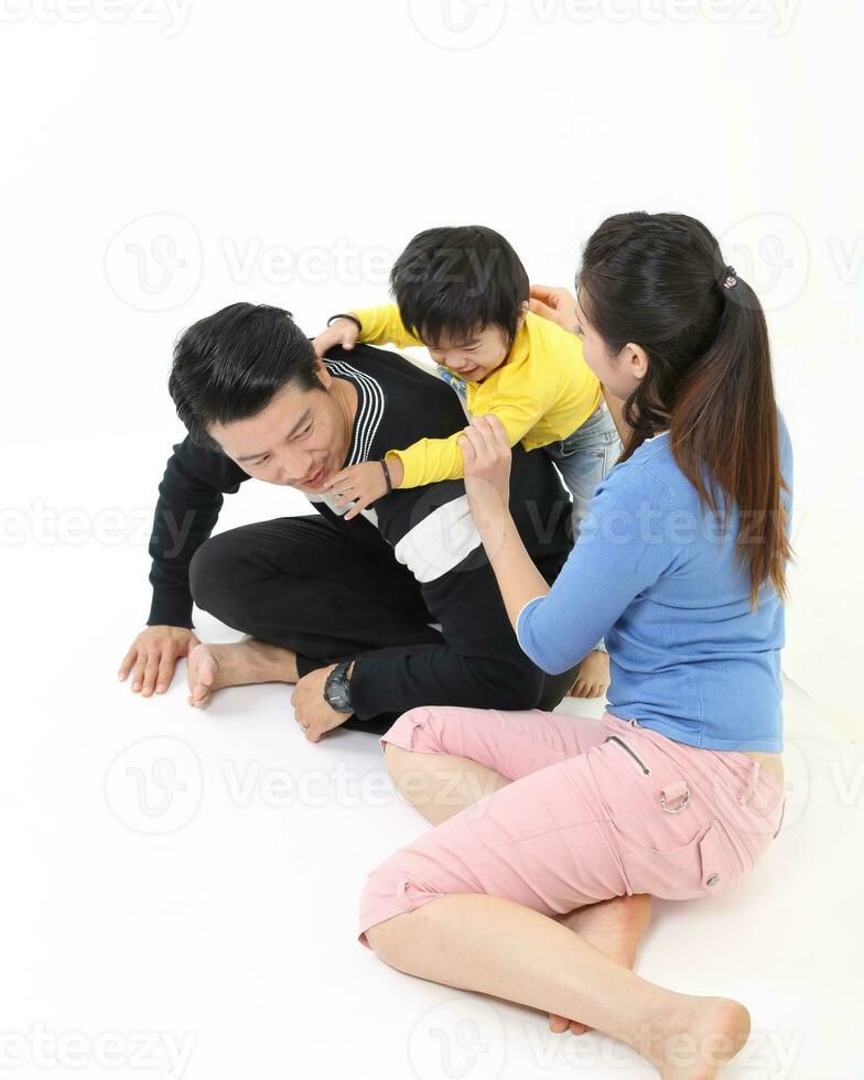 South East Asian young father mother daughter son parent boy girl child activity indoor photo