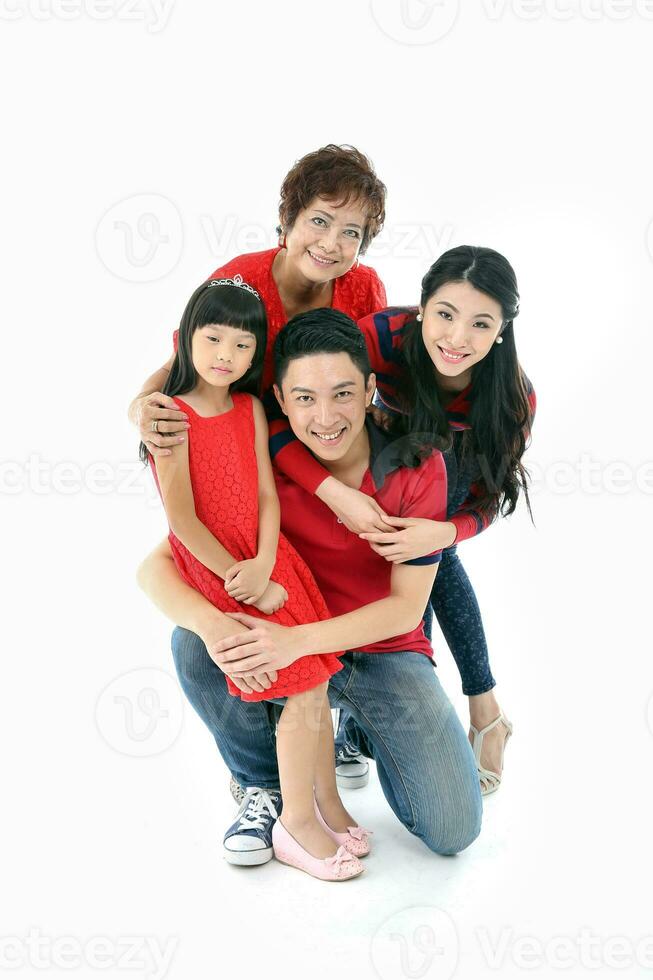 Southeast Asian multigeneration family parents daughter grandmother father mother child pose happy sit stand photo