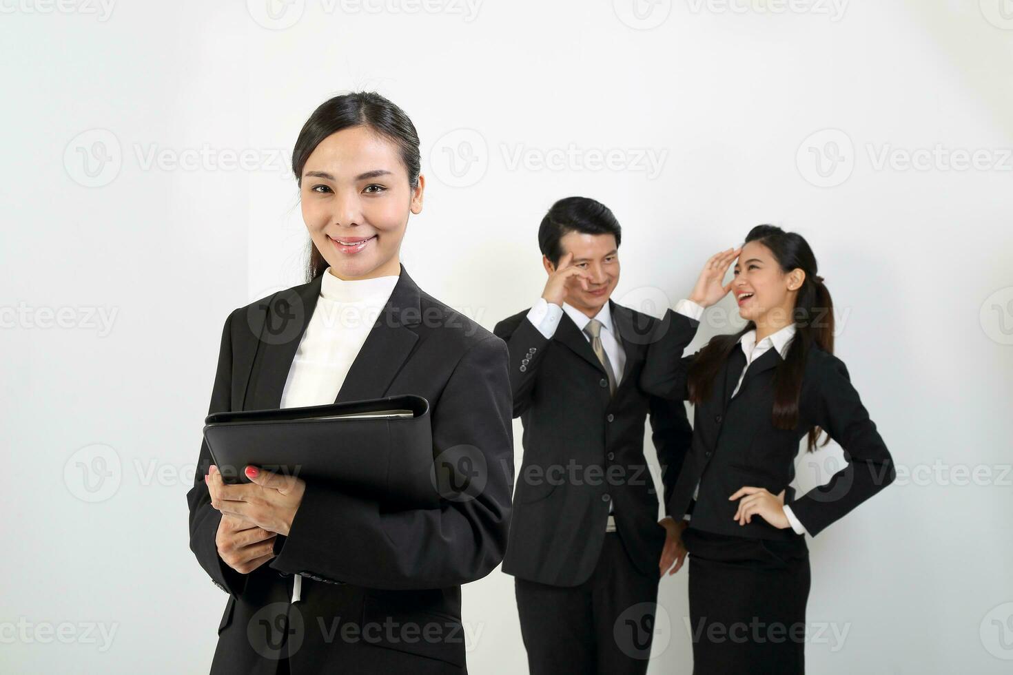 Young Asian male female wearing business office suit stand look at camera cross hand photo