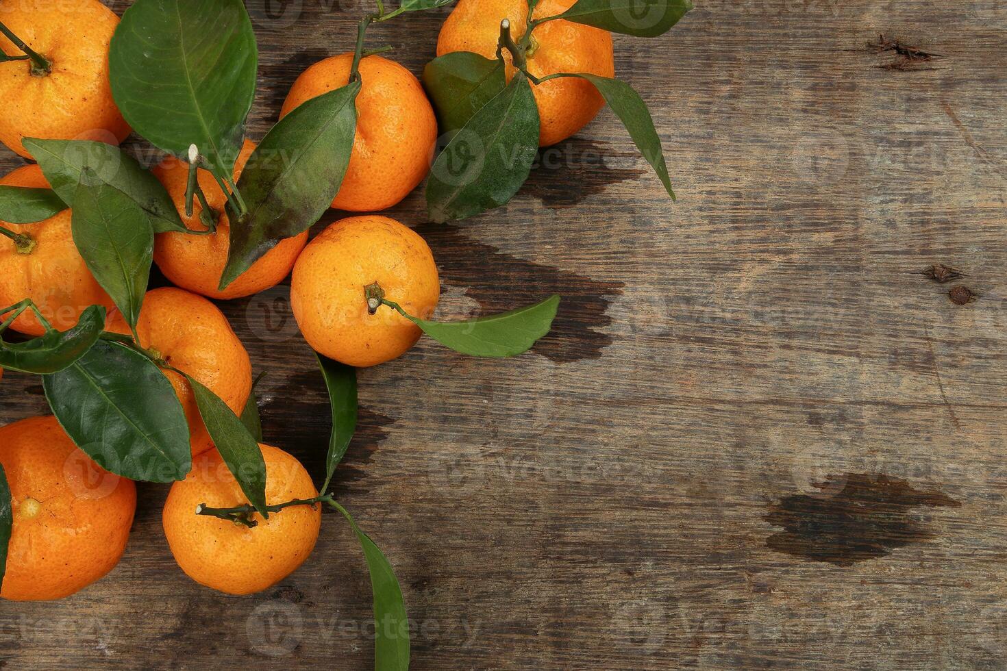 mandarin orange green leaf wood crate box top view copy text space frame on rustic wooden background photo