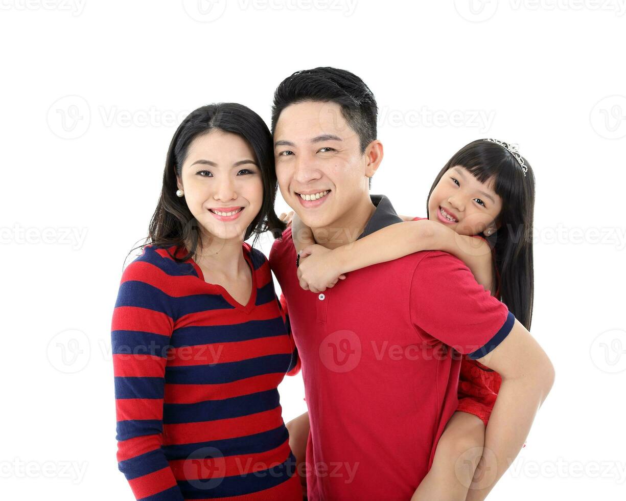 Southeast Asian family parents daughter father mother child pose happy stand piggyback on white background photo