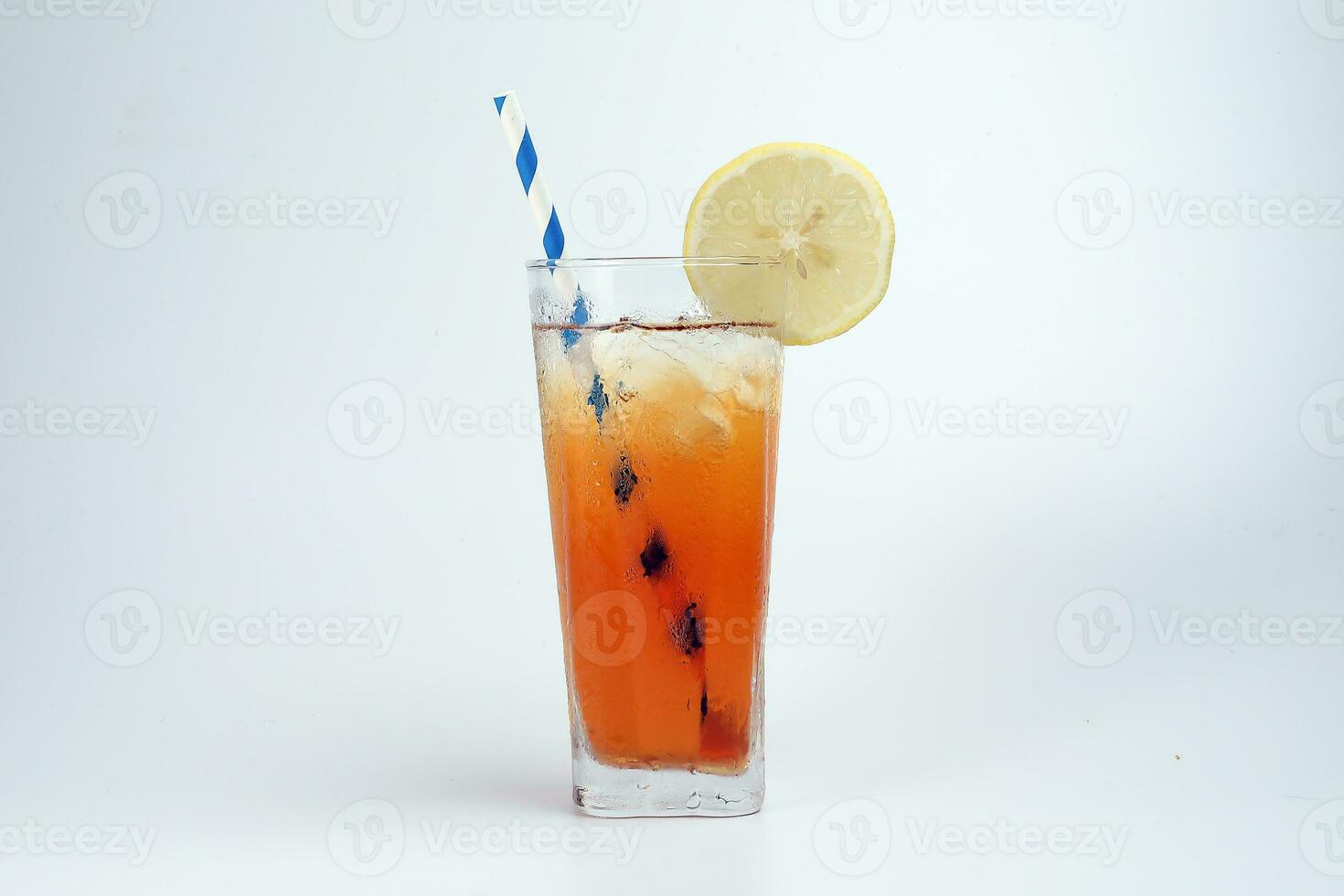 Ice lemon tea with ice cube yellow lemon slice blue white paper straw on white background photo