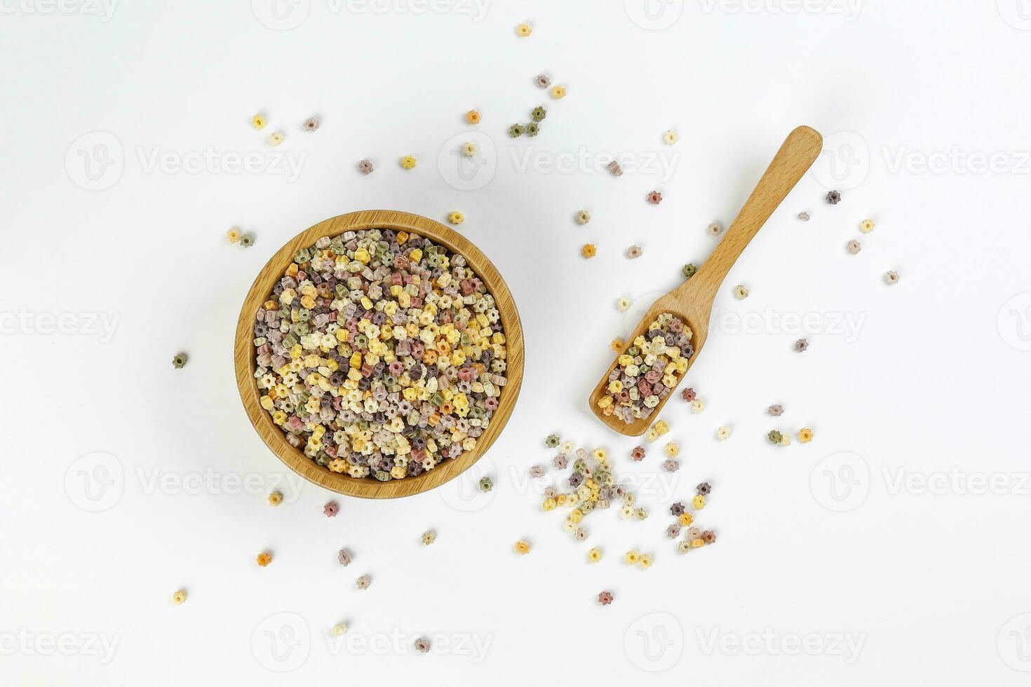 Colourful star shaped pasta macaroni vegetable on white background photo