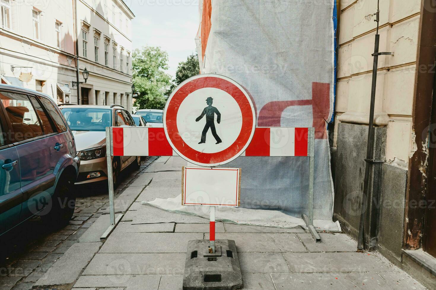 No passing on the street sign. Construction work. Prohibit people from passing warning sign. No pedestrian traffic sign. No pass sign. No entry for people hangs on the street photo