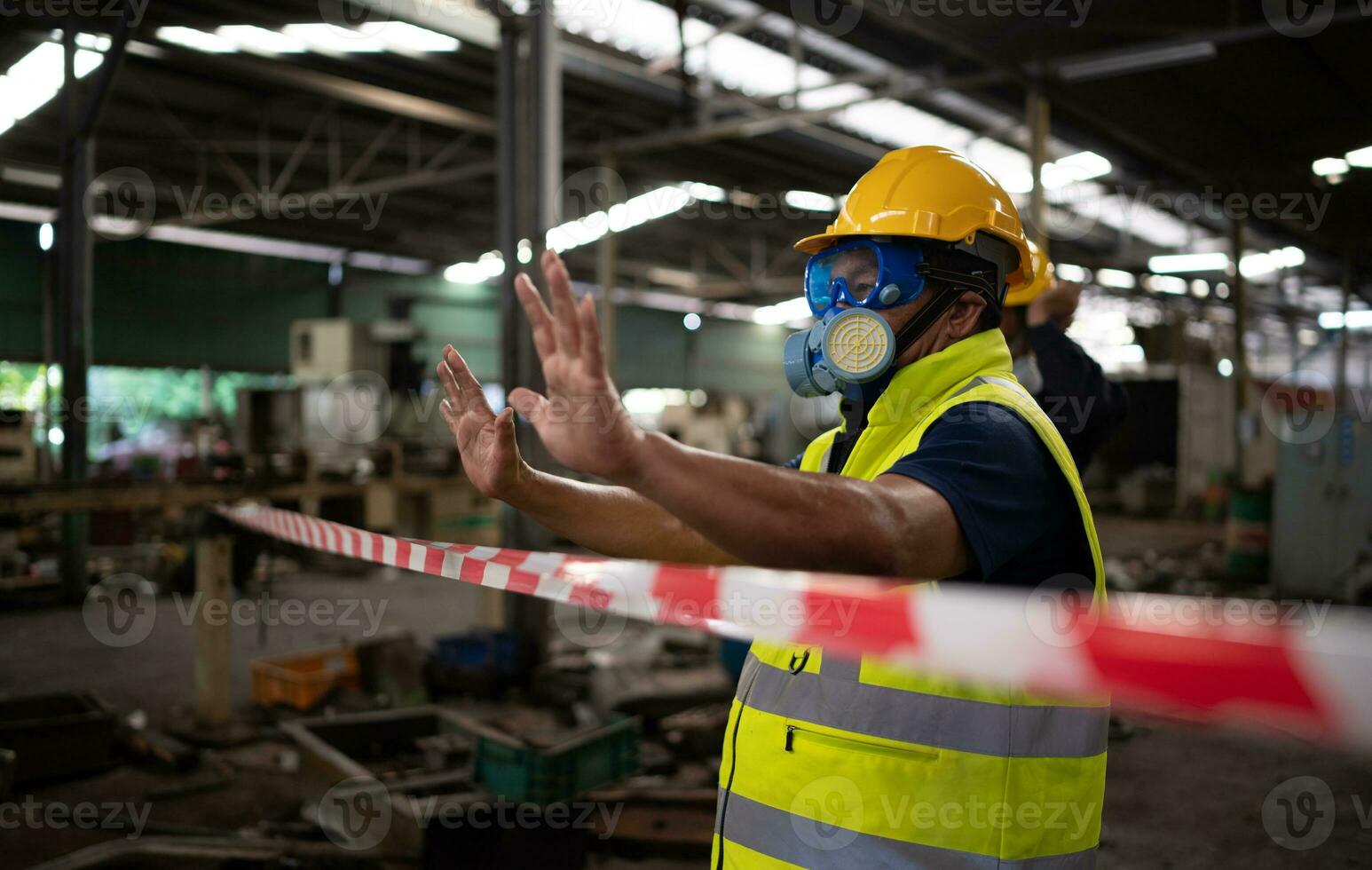 Restricted area, officials employ white and red stripes to block the area where a chemical leak is occurring. To prevent individuals from coming into contact with potentially dangerous chemicals, photo