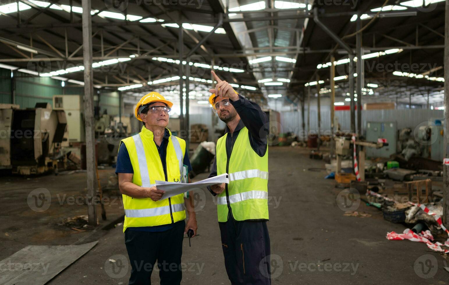 Portrait of technician team leader and team that is ready for repairing old machinery to return to normal operation in the company's old machinery warehouse photo