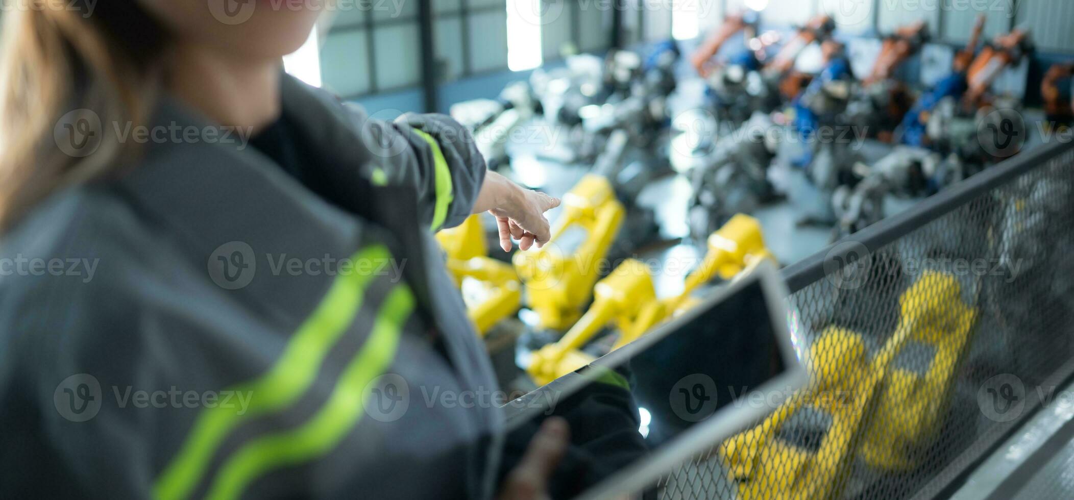 A female auditor Inspected to account for the company's robot assets that were brought to the warehouse before delivering to customers. photo