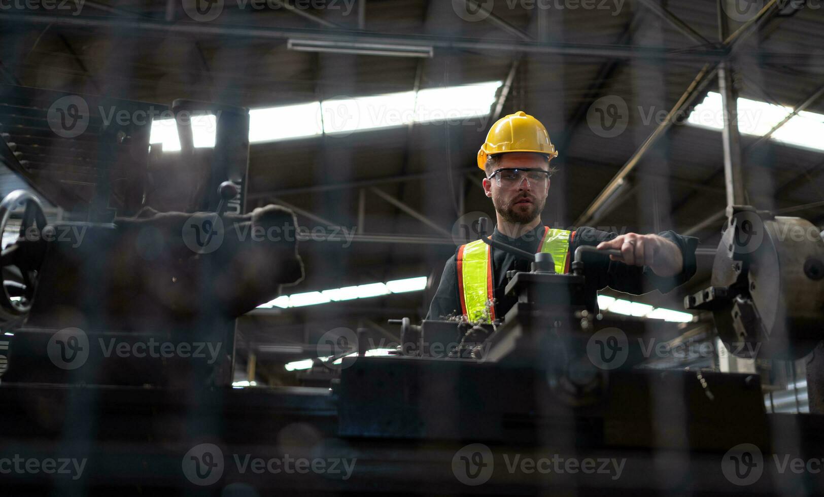 Mechanical engineers enter the old machinery warehouse to inspect and repair used machinery with the warehouse's personnel. photo