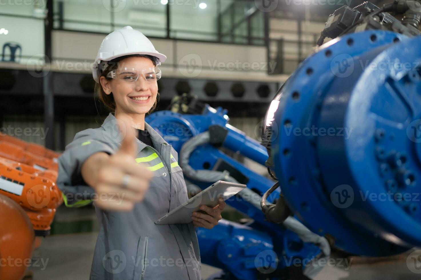 A female engineer completed the updating software and calibrating a robotics arm, Ready to deliver to the next customer. photo