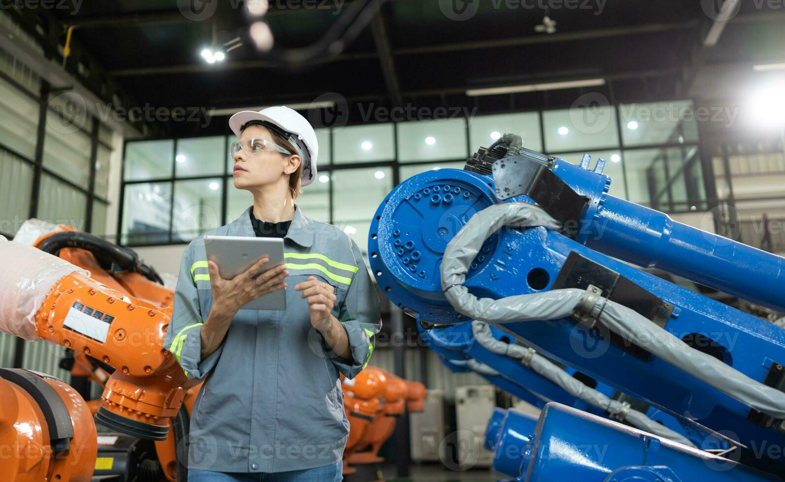 A female auditor Inspected to account for the company's robot assets that were brought to the warehouse before delivering to customers. photo