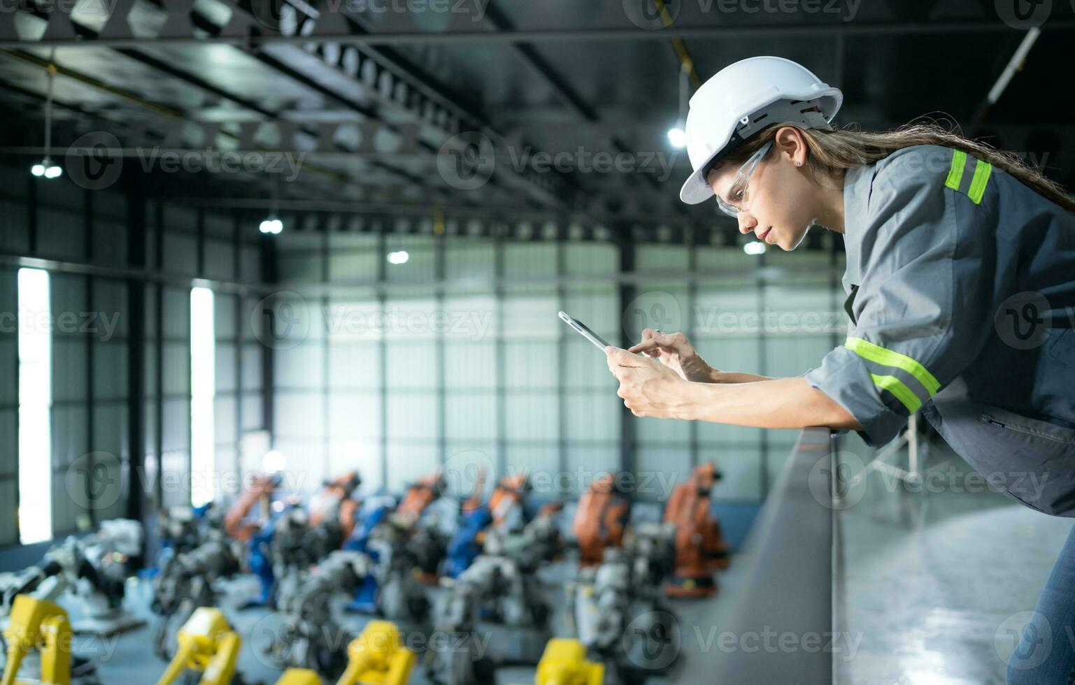 A female auditor Inspected to account for the company's robot assets that were brought to the warehouse before delivering to customers. photo